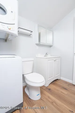 a bathroom with a toilet and a sink