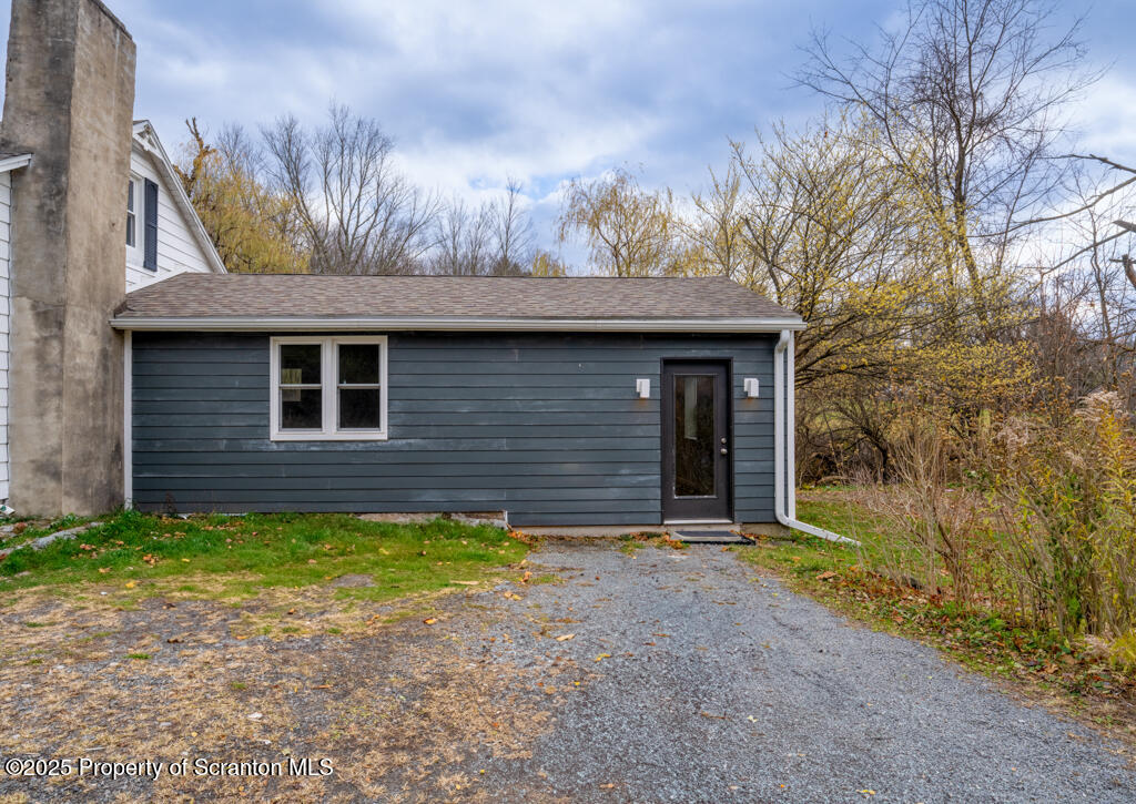 240 Craig Road Dalton, PA 18414 - Photo 3 of 15 a front view of a house with a yard
