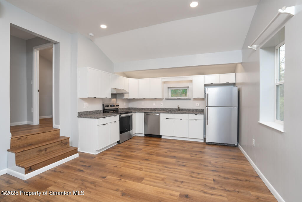 240 Craig Road Dalton, PA 18414 - Photo 4 of 15 a kitchen with stainless steel appliances granite countertop a refrigerator sink and white cabinets