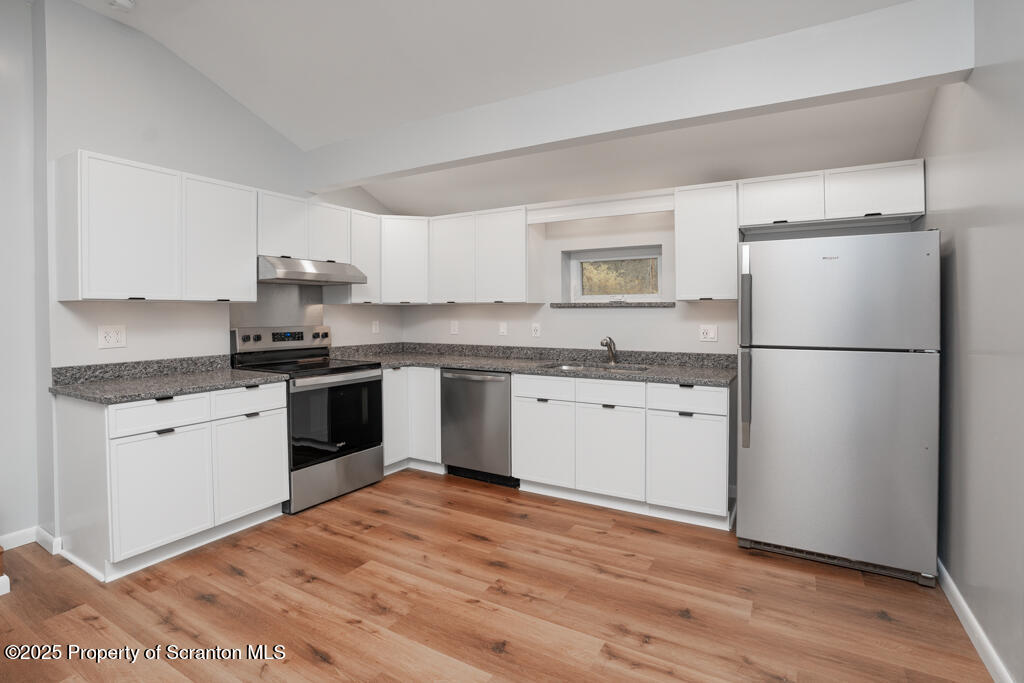 240 Craig Road Dalton, PA 18414 - Photo 5 of 15 a kitchen with a refrigerator stove top oven and sink
