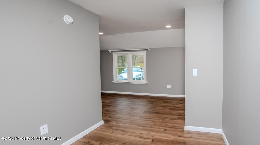 240 Craig Road Dalton, PA 18414 - Photo 10 of 15 a view of an empty room with wooden floor and a window