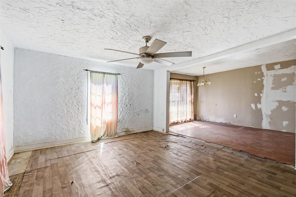 1703 Navaro Street Dallas, TX 75208 - Photo 10 of 28 wooden floor in an empty room with a window