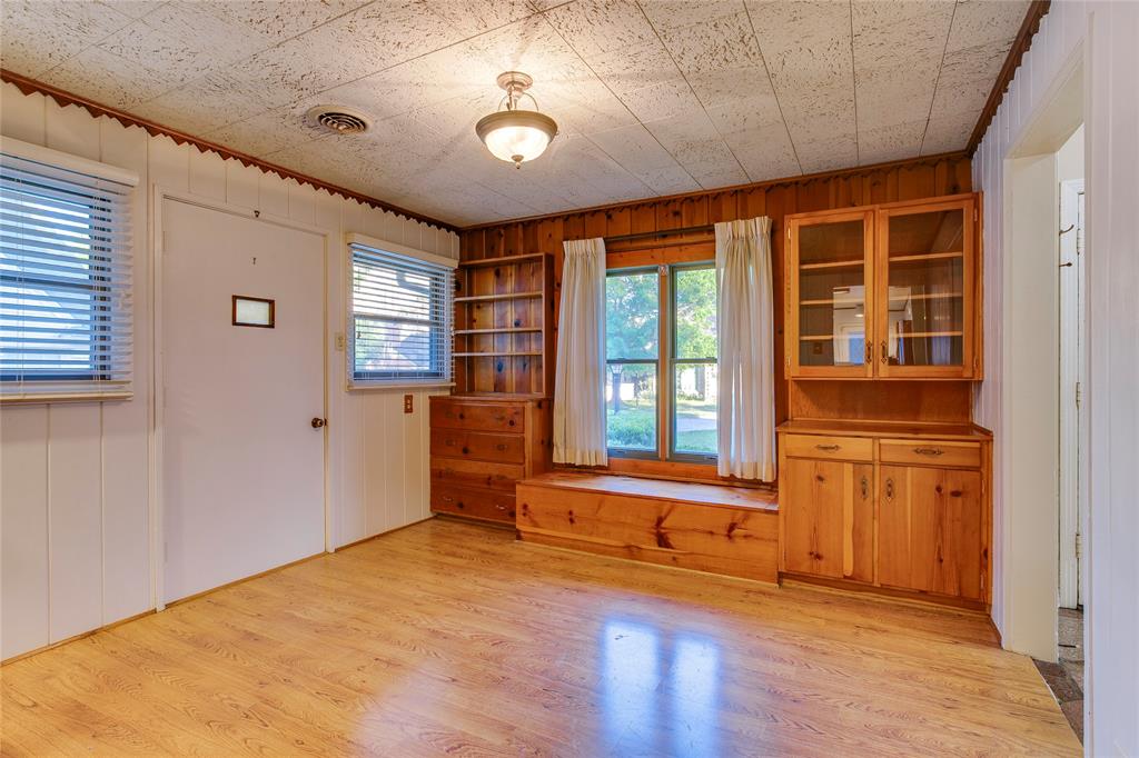 1439 Jr Drive Dallas, TX 75208 - Photo 13 of 39 an empty room with wooden floor and windows
