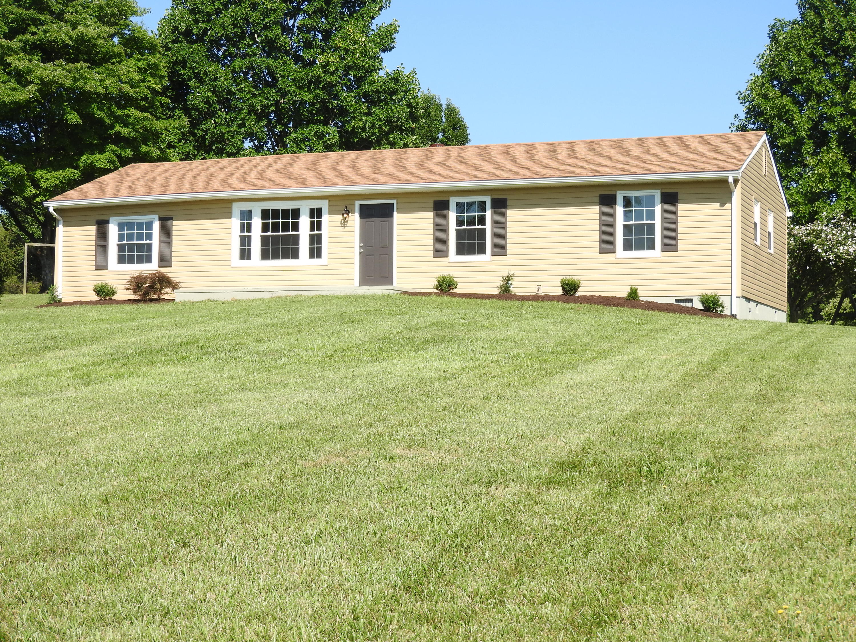 1873 Morgans Mill Road Goodview, VA 24095 - Photo 1 of 26 a view of a house with a backyard