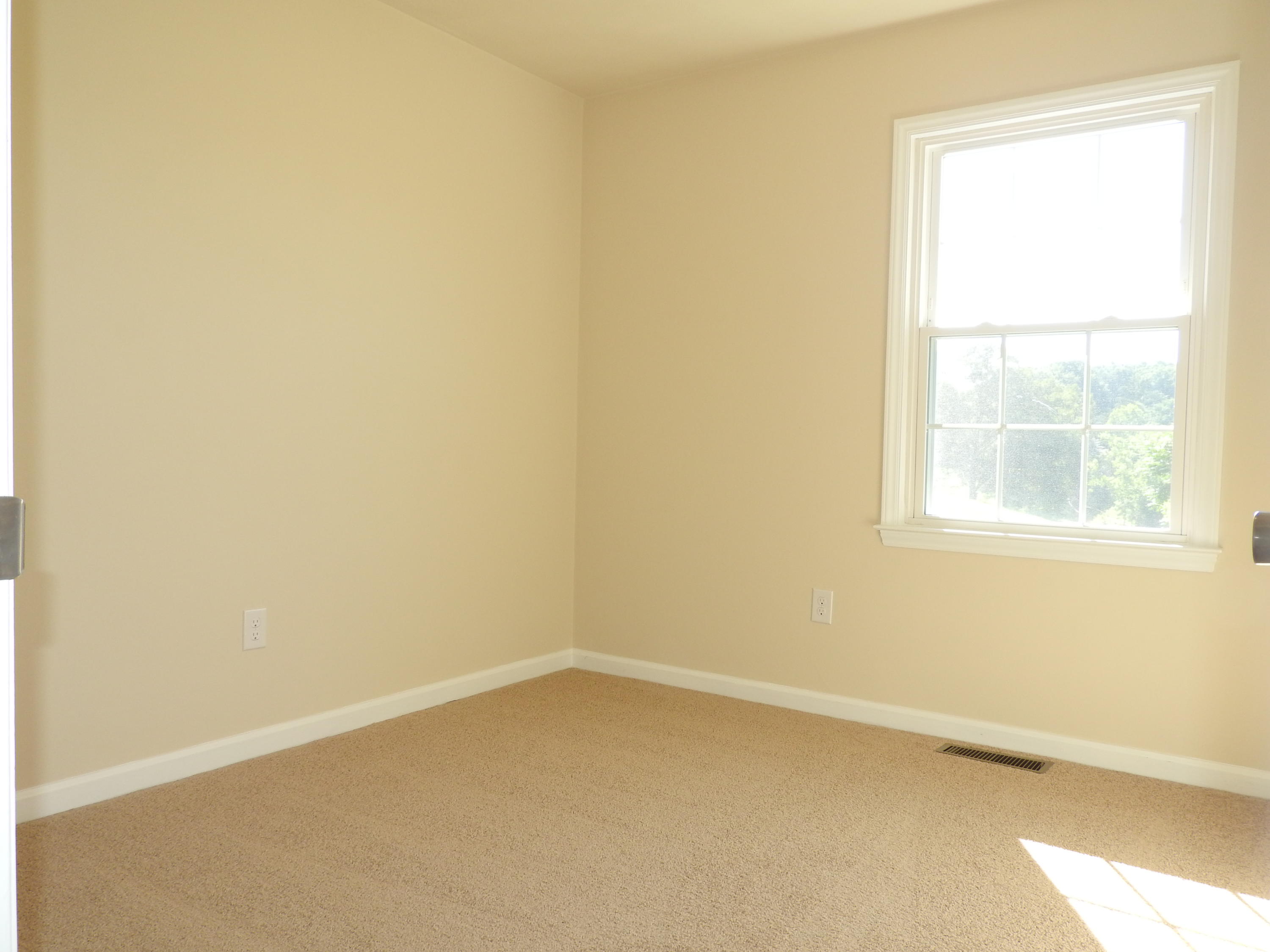 1873 Morgans Mill Road Goodview, VA 24095 - Photo 14 of 26 an empty room with a window