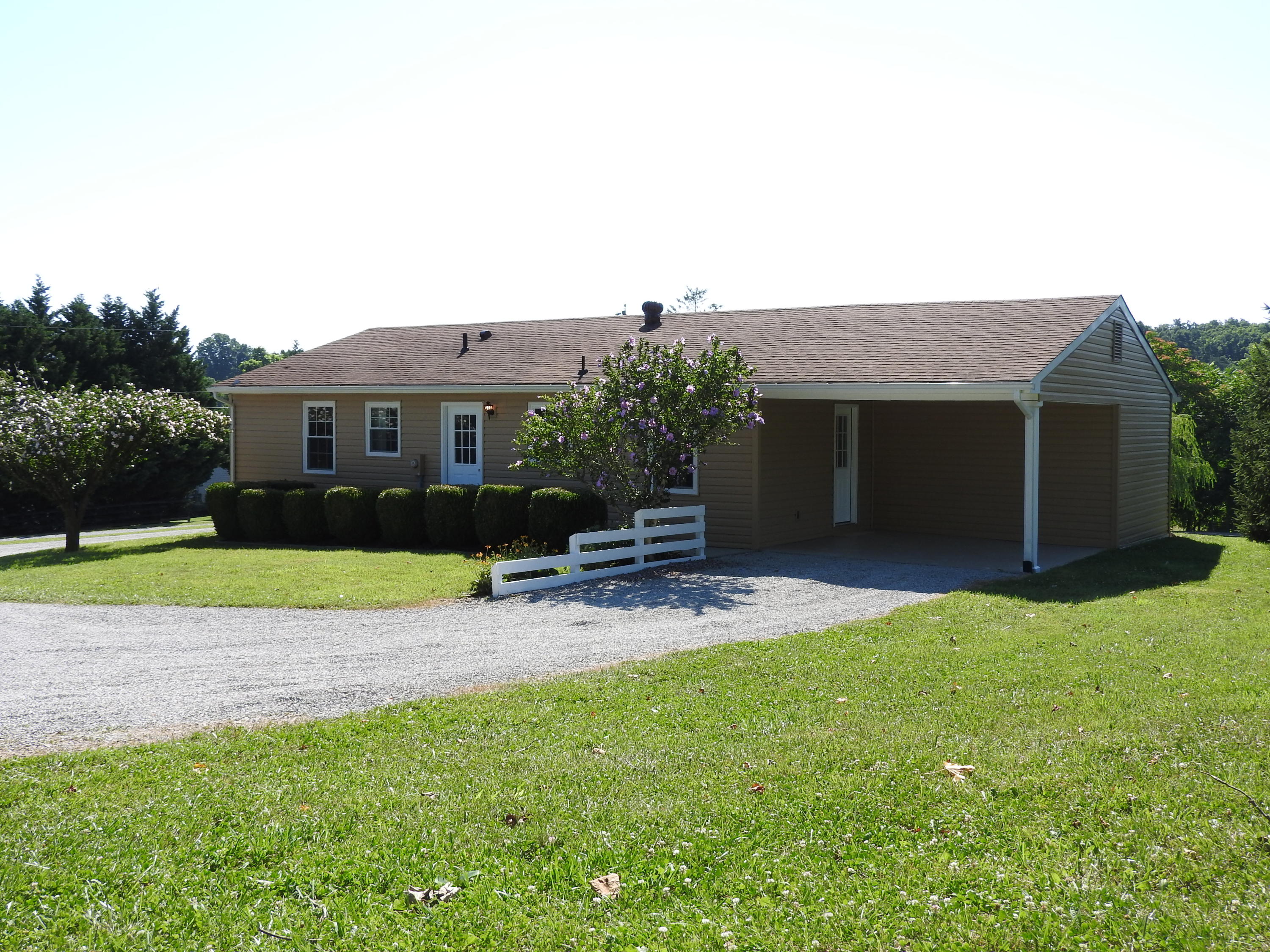 1873 Morgans Mill Road Goodview, VA 24095 - Photo 23 of 26 a house view with a garden space