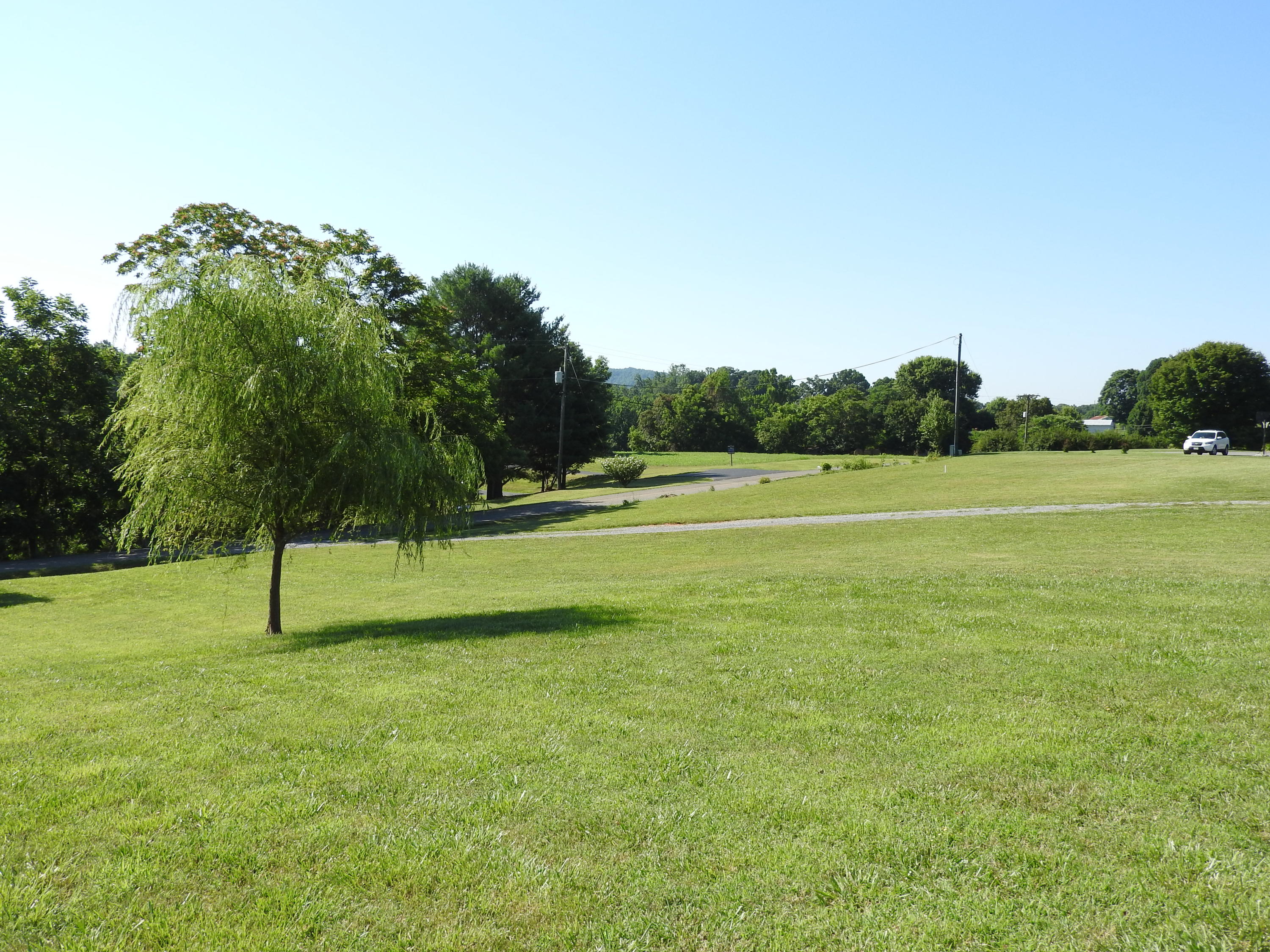 1873 Morgans Mill Road Goodview, VA 24095 - Photo 24 of 26 a view of outdoor space with deck and trees