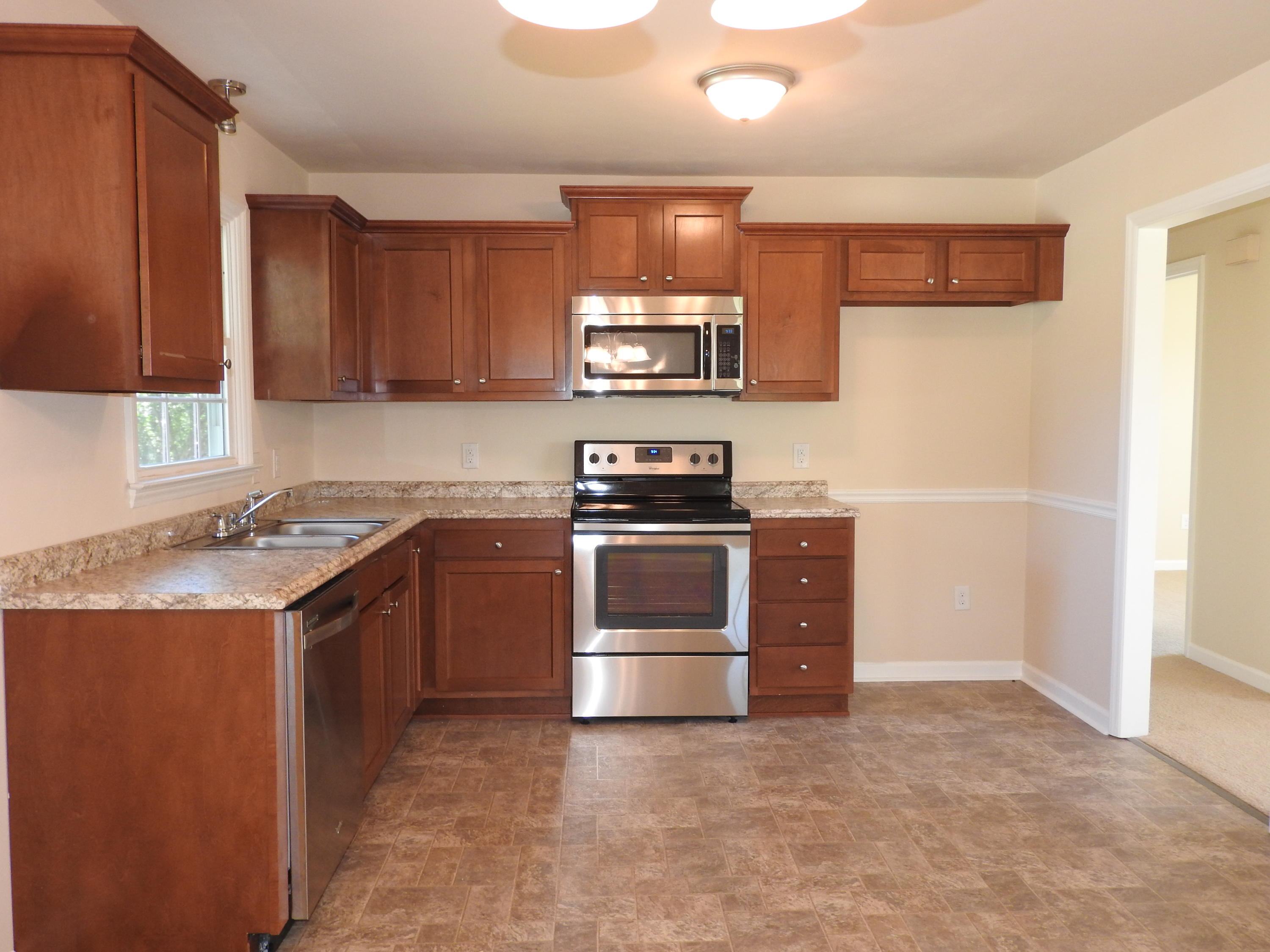 1873 Morgans Mill Road Goodview, VA 24095 - Photo 5 of 26 a kitchen with a sink and a stove