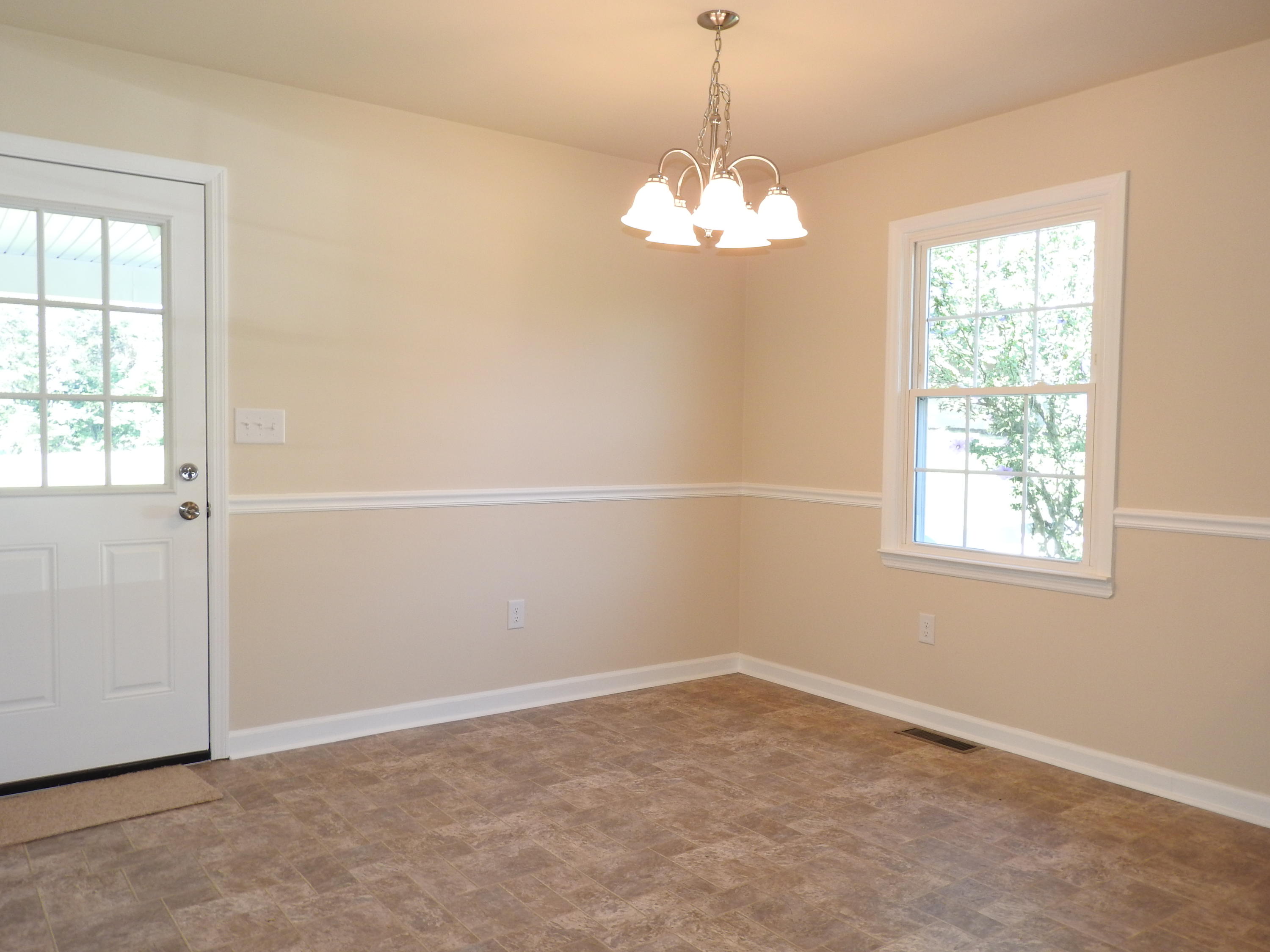 1873 Morgans Mill Road Goodview, VA 24095 - Photo 6 of 26 an empty room with a window