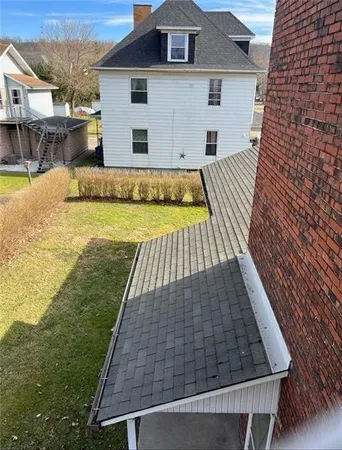 a front view of a house with swimming pool
