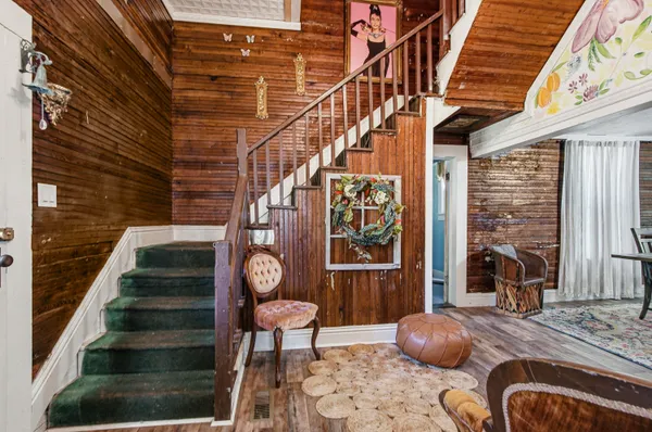a view of entryway with wooden floor