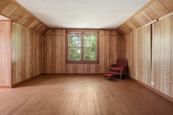 a view of a room with furniture and a window