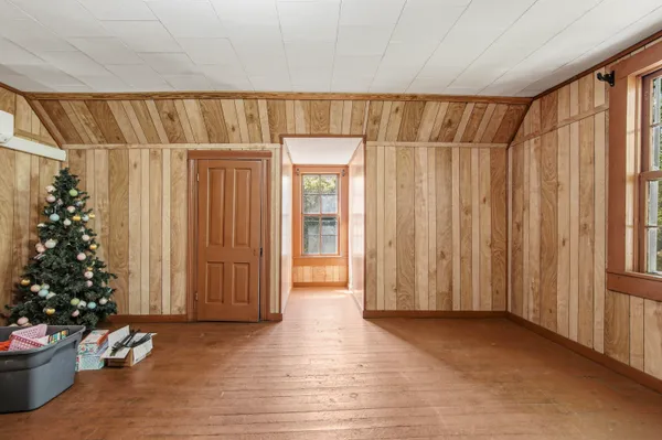 a view of wooden floor with plants in pots
