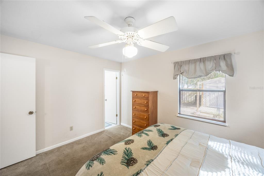 545 Southwest 257 Terrace Newberry, FL 32669 - Photo 16 of 46 a bedroom with a large bed and a window