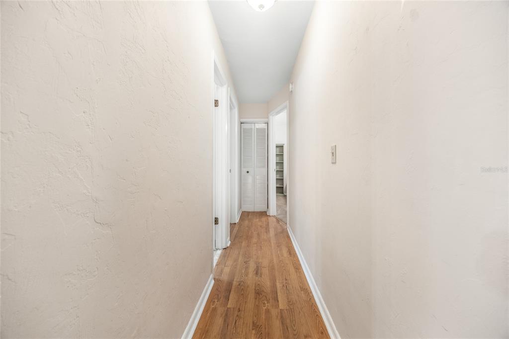 545 Southwest 257 Terrace Newberry, FL 32669 - Photo 17 of 46 a view of a hallway with wooden floor