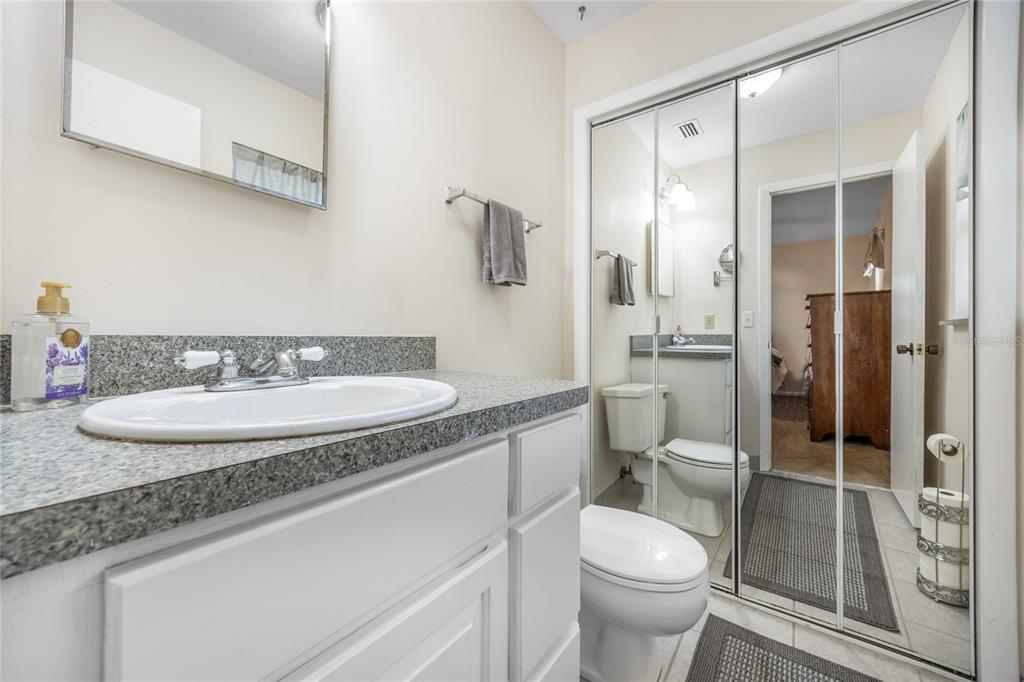 545 Southwest 257 Terrace Newberry, FL 32669 - Photo 20 of 46 a bathroom with a granite countertop toilet sink and shower