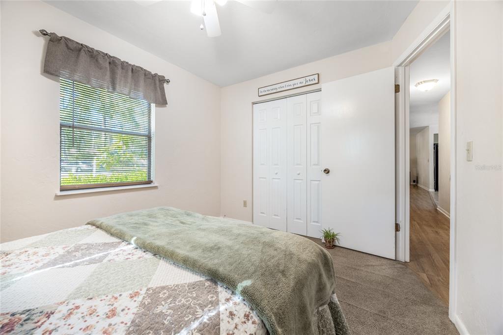 545 Southwest 257 Terrace Newberry, FL 32669 - Photo 22 of 46 a bedroom with a bed and a window