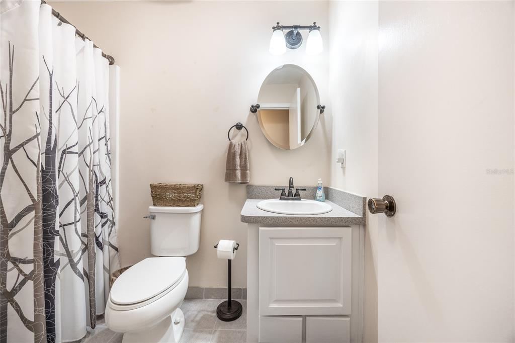 545 Southwest 257 Terrace Newberry, FL 32669 - Photo 25 of 46 a bathroom with a toilet sink and mirror