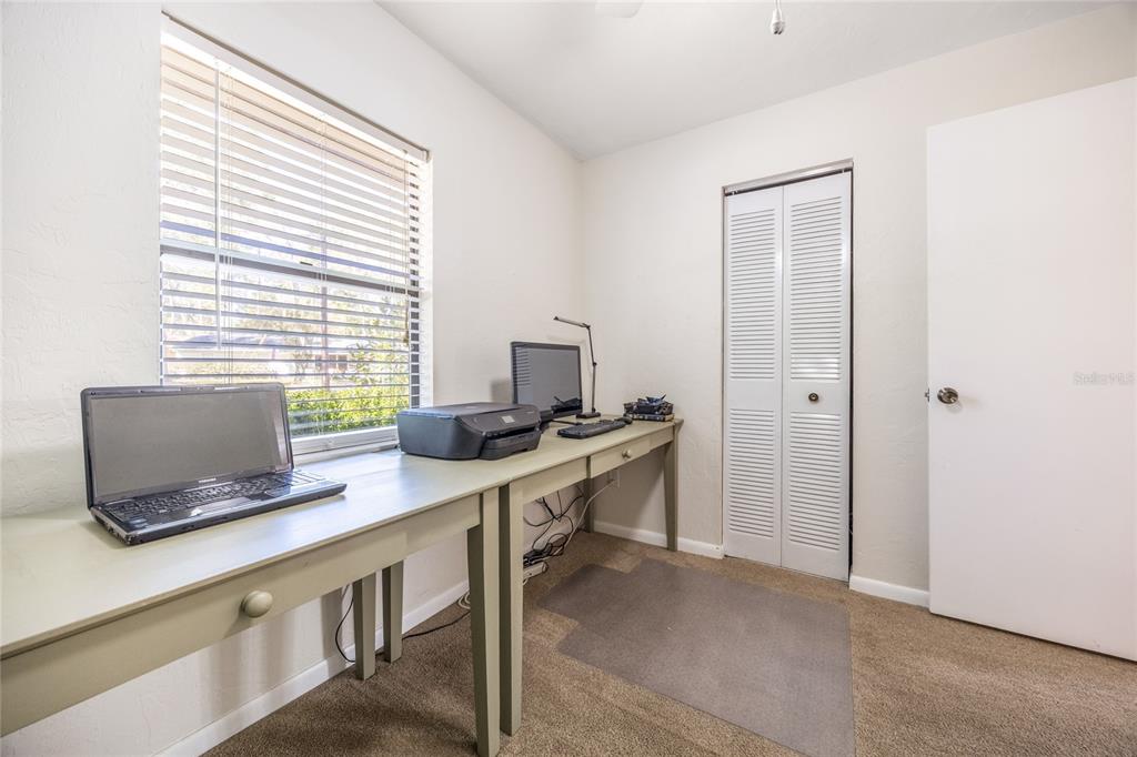 545 Southwest 257 Terrace Newberry, FL 32669 - Photo 28 of 46 a view of a workspace with furniture and a window