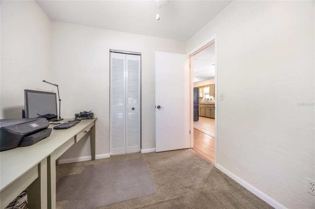 545 Southwest 257 Terrace Newberry, FL 32669 - Photo 29 of 46 a view of a hallway with workspace and a window
