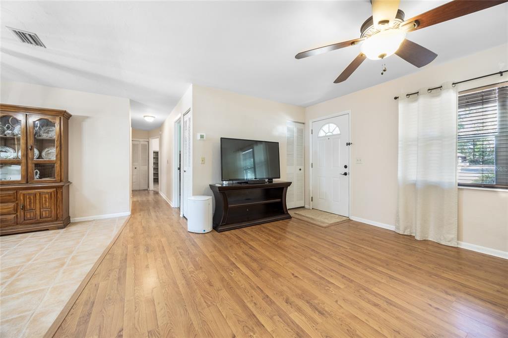 545 Southwest 257 Terrace Newberry, FL 32669 - Photo 3 of 46 a large bedroom with a bed and a flat screen tv