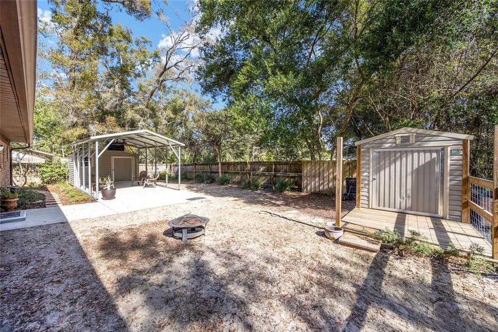 545 Southwest 257 Terrace Newberry, FL 32669 - Photo 34 of 46 a backyard of a house with basket ball court