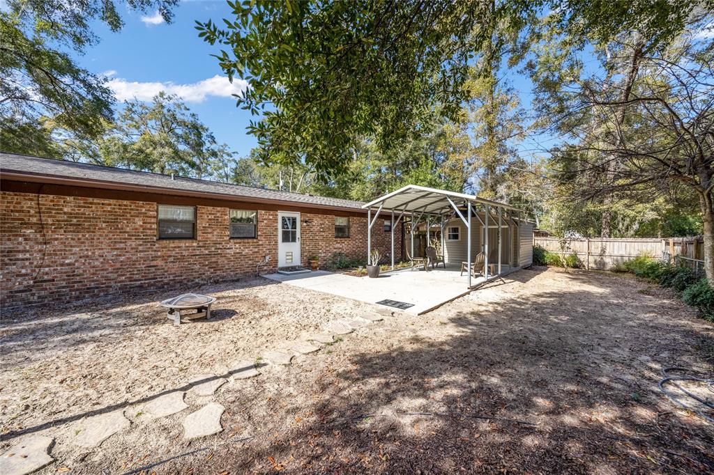 545 Southwest 257 Terrace Newberry, FL 32669 - Photo 37 of 46 a house with trees in the background