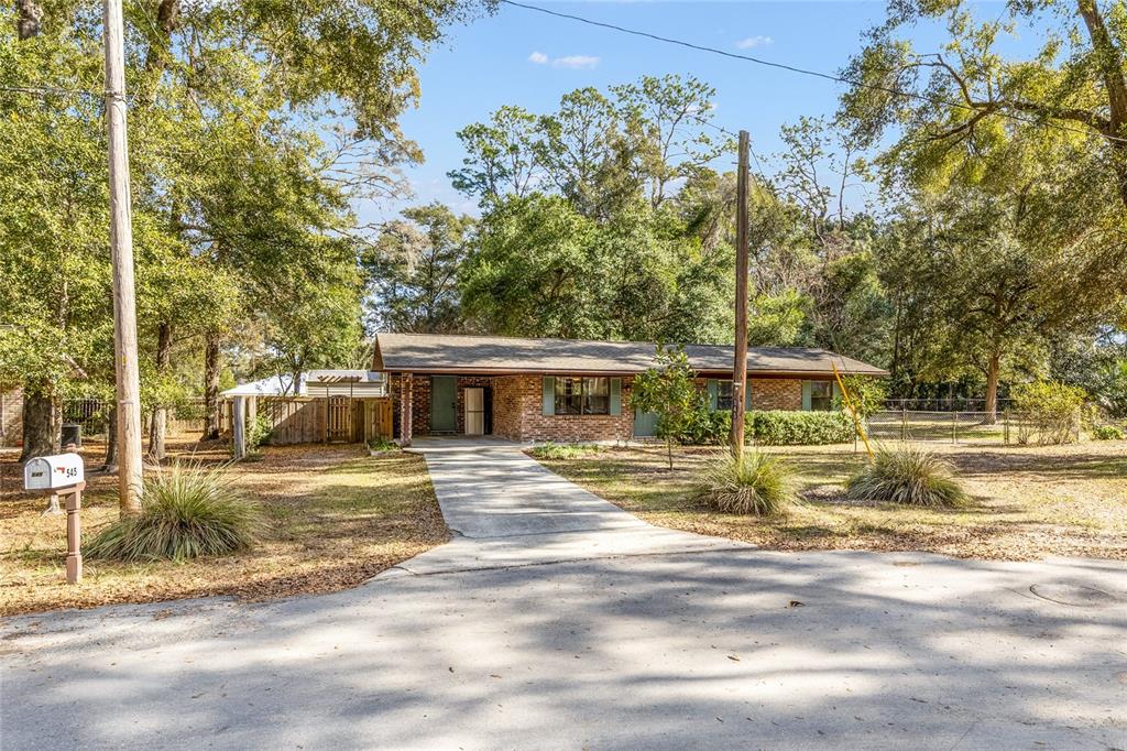 545 Southwest 257 Terrace Newberry, FL 32669 - Photo 38 of 46 a view of a house with backyard
