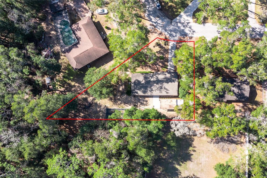 545 Southwest 257 Terrace Newberry, FL 32669 - Photo 46 of 46 a aerial view of a house with a yard and garden