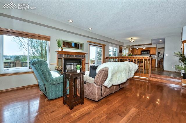 2208 Ramsgate Terrace Colorado Springs, CO 80919 - Photo 11 of 32 Family room with wood floors and and open concept views throughout