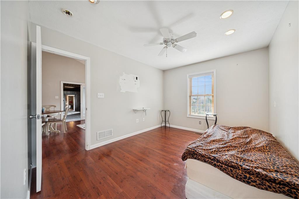 1512 Abers Creek Road Pittsburgh, PA 15239 - Photo 13 of 39 a bedroom with a bed and a chandelier