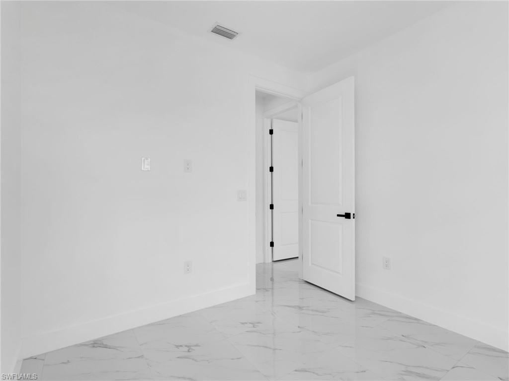 3419 8th Street Southwest Lehigh Acres, FL 33976 - Photo 16 of 29 a view of an empty room