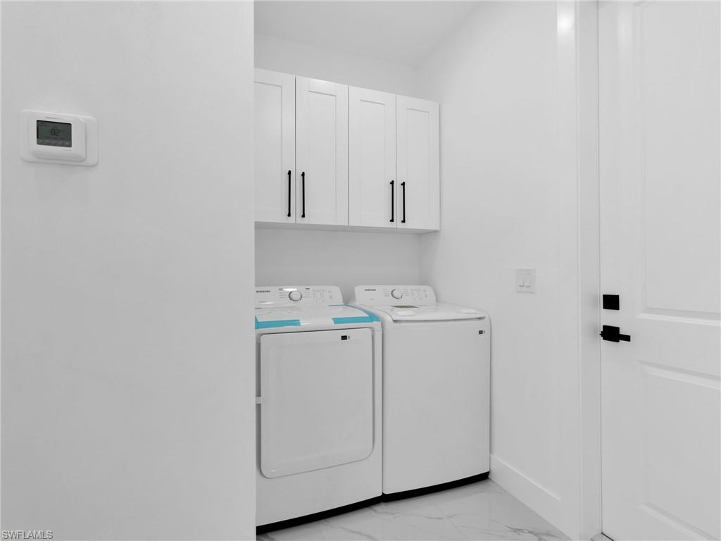 3419 8th Street Southwest Lehigh Acres, FL 33976 - Photo 24 of 29 a view of utility room with washer and dryer
