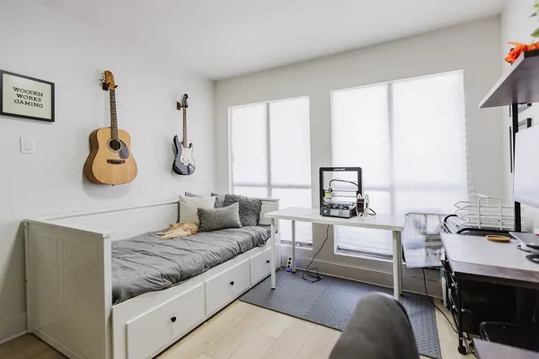 a living room with furniture and white walls