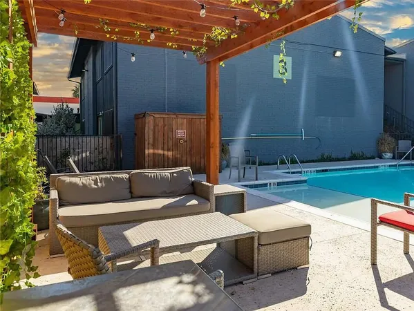 a view of backyard with outdoor seating