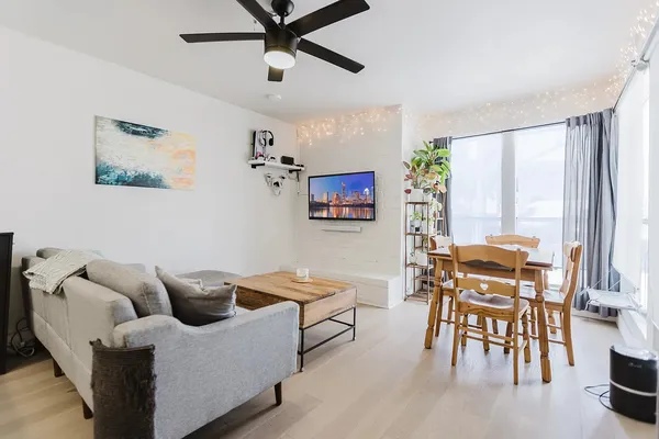 a living room with furniture and a large window