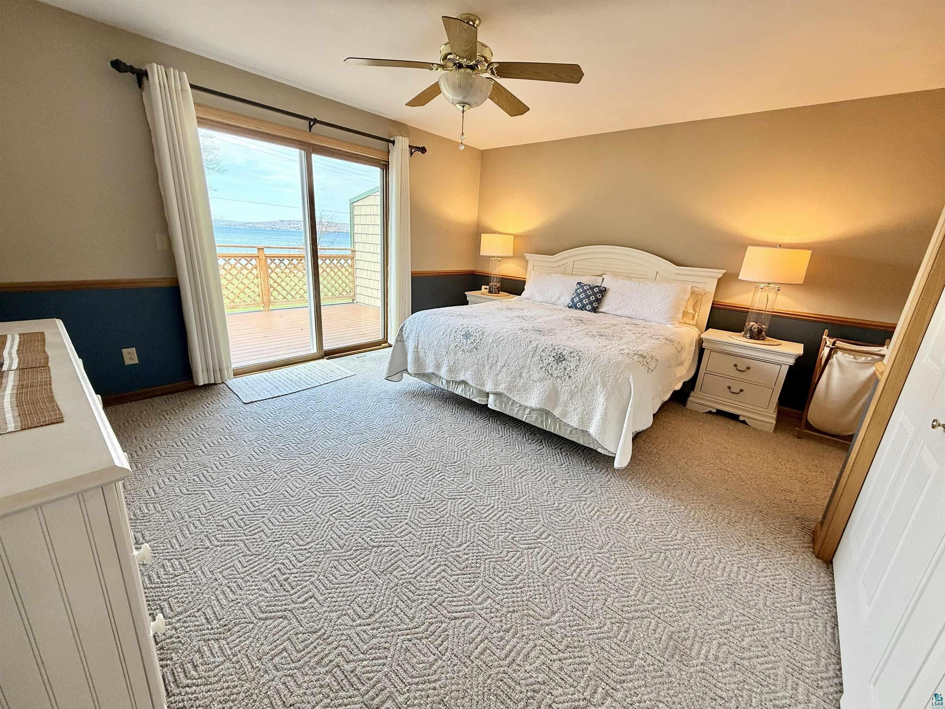 668 Fort Road, Unit 5 La Pointe, WI 54850 - Photo 4 of 27 Primary bedroom with spectacular sunsets