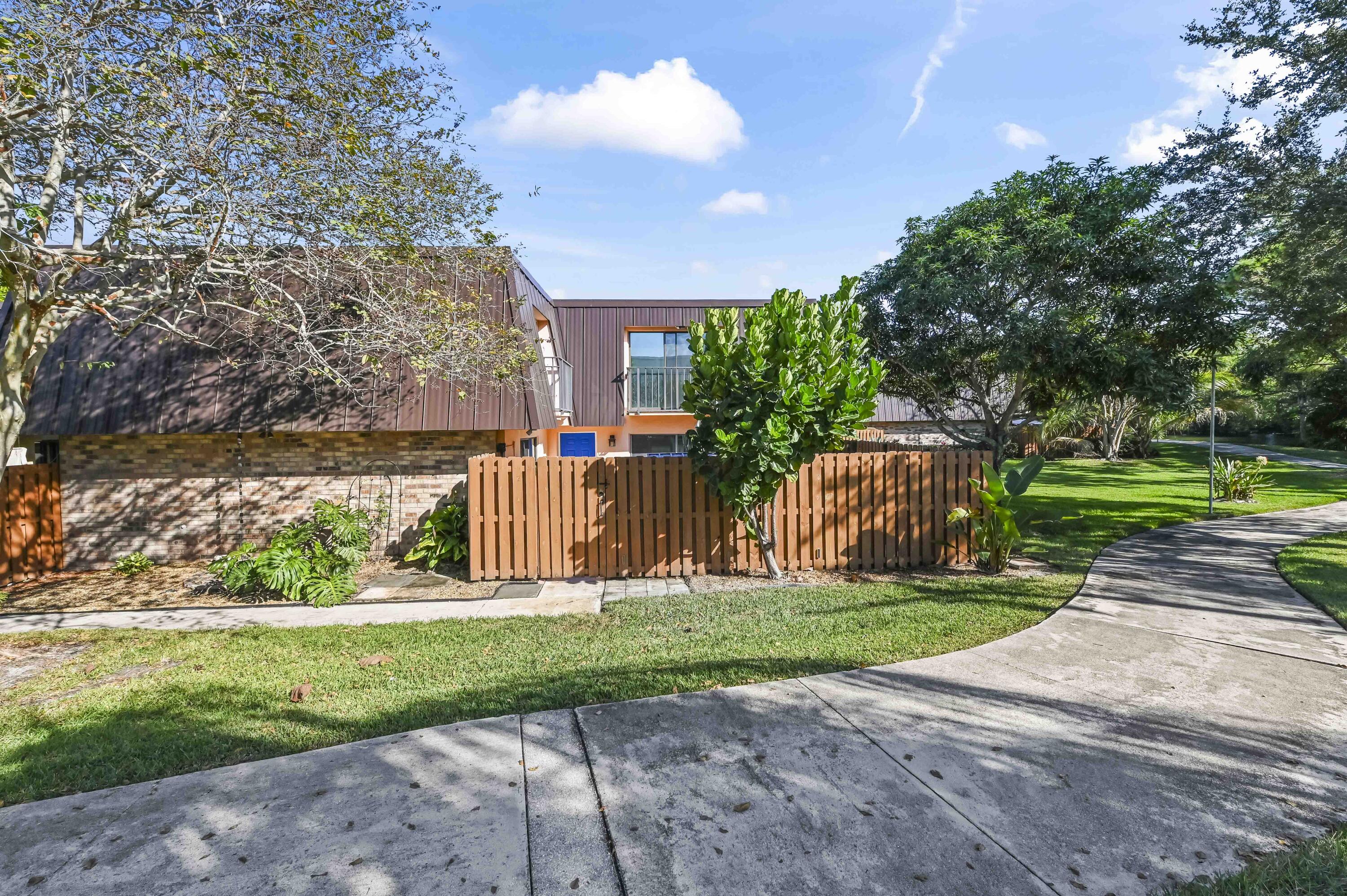 5708 Southeast Windsong Lane Stuart, FL 34997 - Photo 1 of 41 a garden view