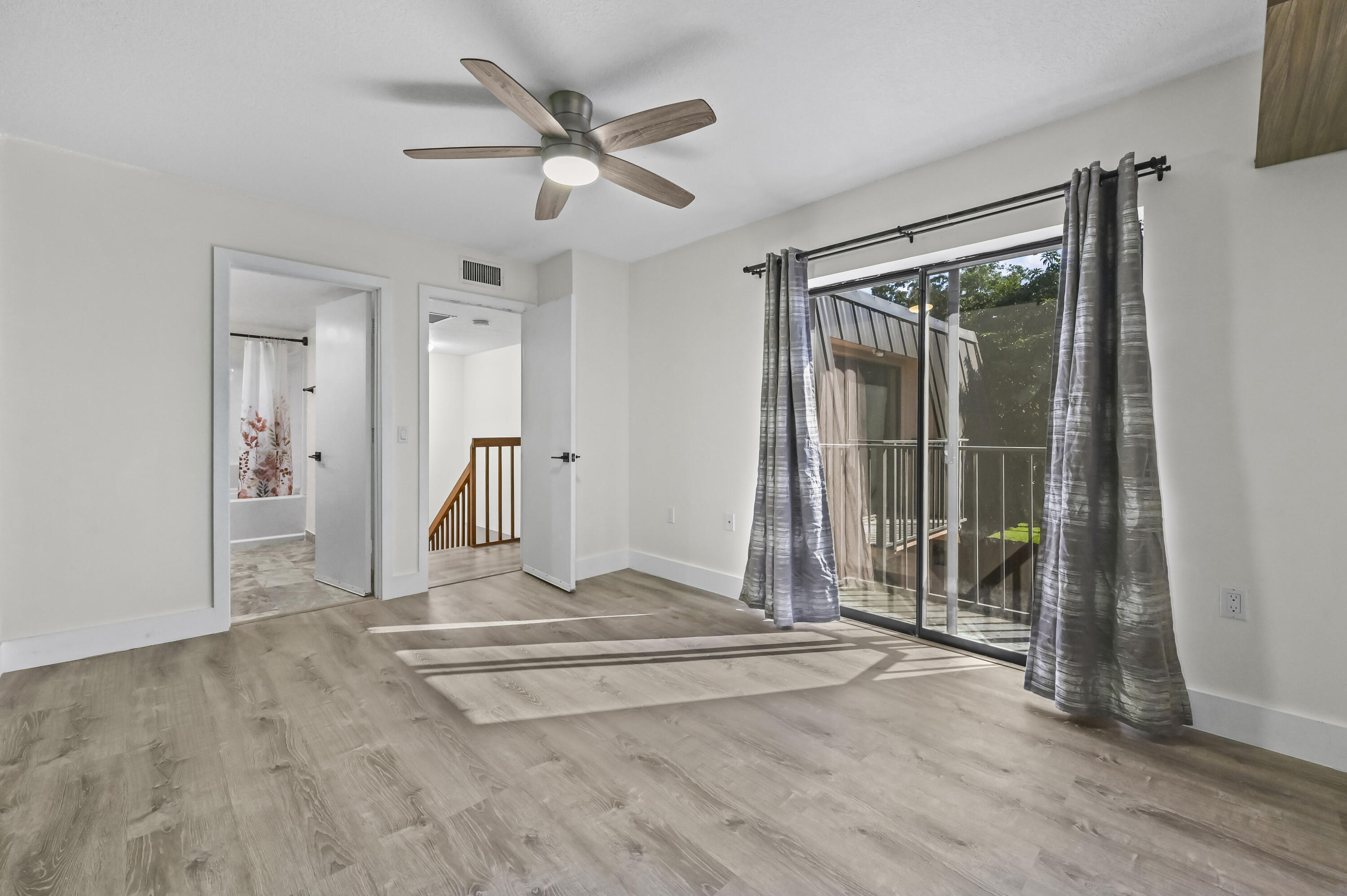 5708 Southeast Windsong Lane Stuart, FL 34997 - Photo 20 of 41 a view of entryway with wooden floor