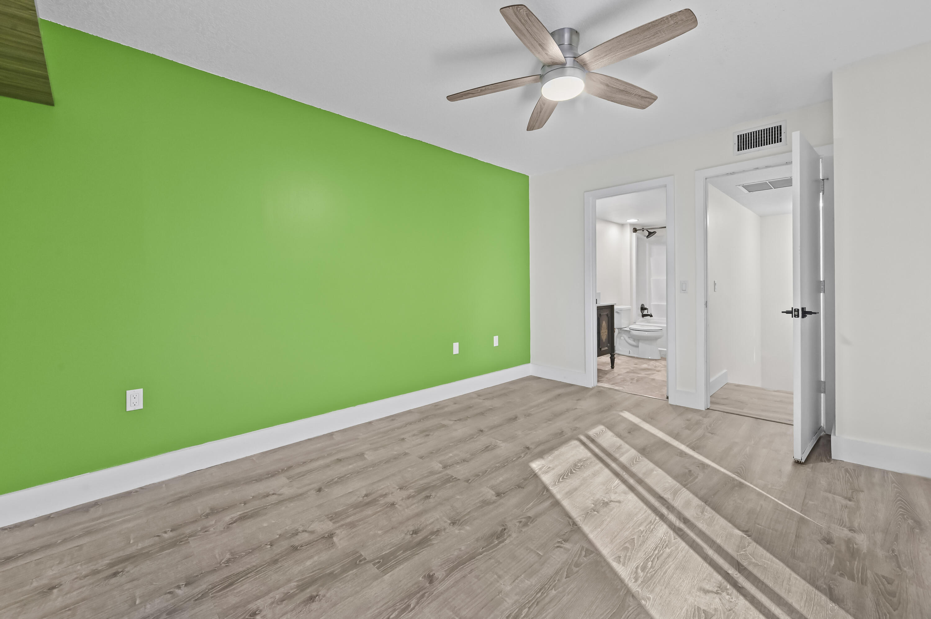 5708 Southeast Windsong Lane Stuart, FL 34997 - Photo 21 of 41 a view of a bedroom with a big room