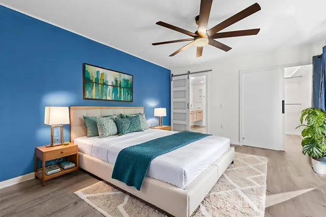 a bedroom with a bed and a table