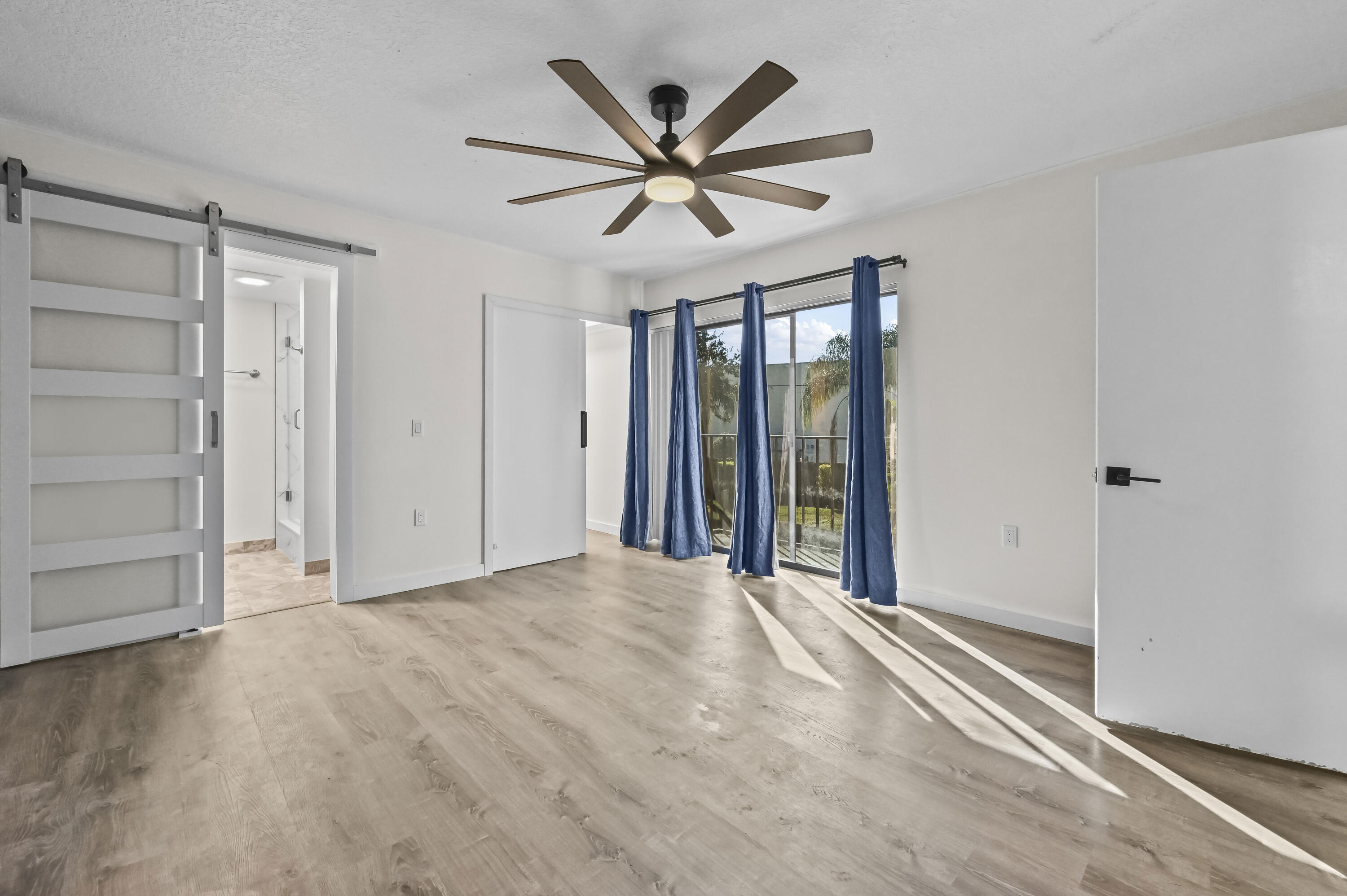 5708 Southeast Windsong Lane Stuart, FL 34997 - Photo 25 of 41 a view of a livingroom with a ceiling fan window and a ceiling fan