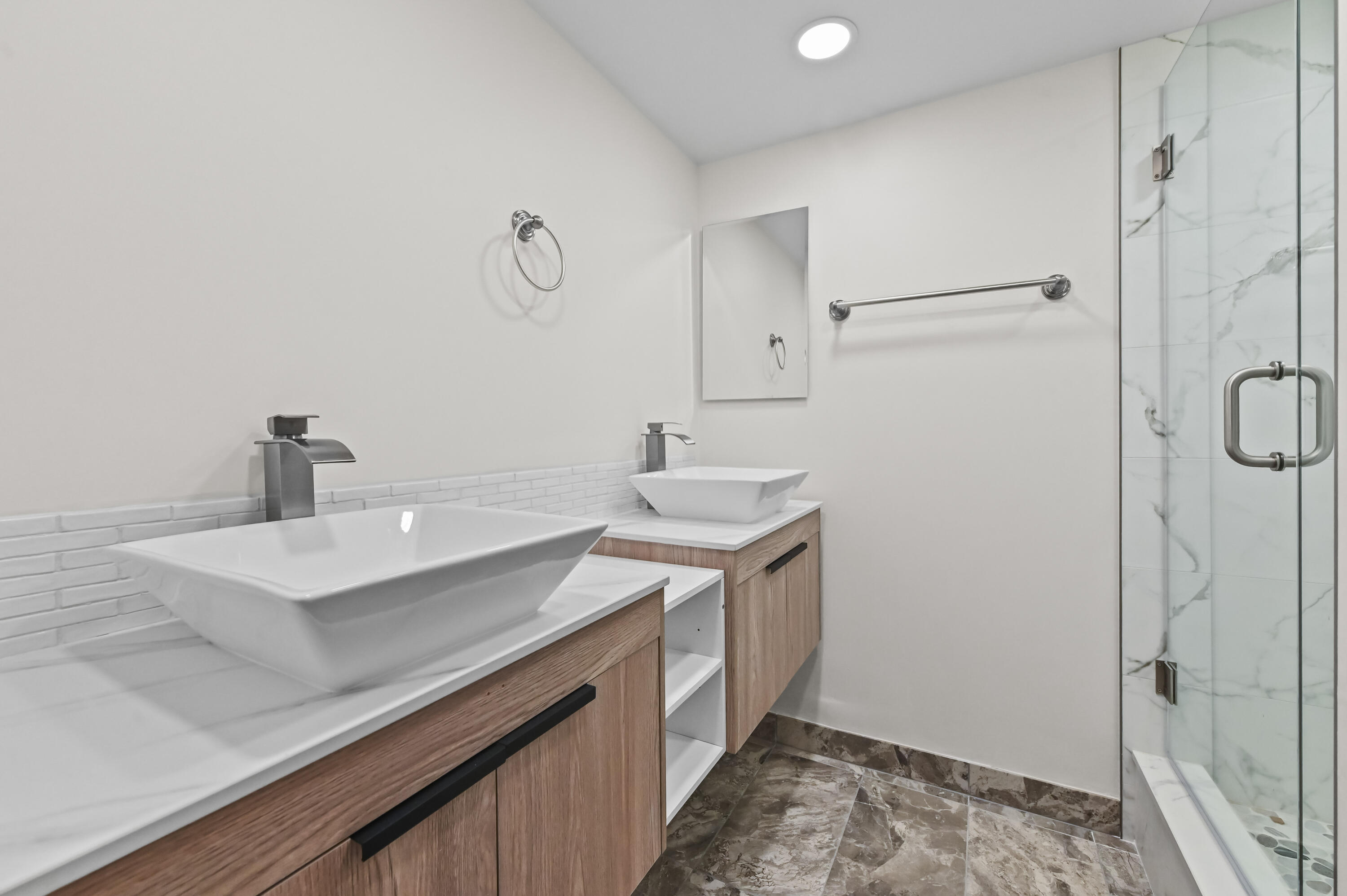 5708 Southeast Windsong Lane Stuart, FL 34997 - Photo 27 of 41 a bathroom with a sink and a mirror