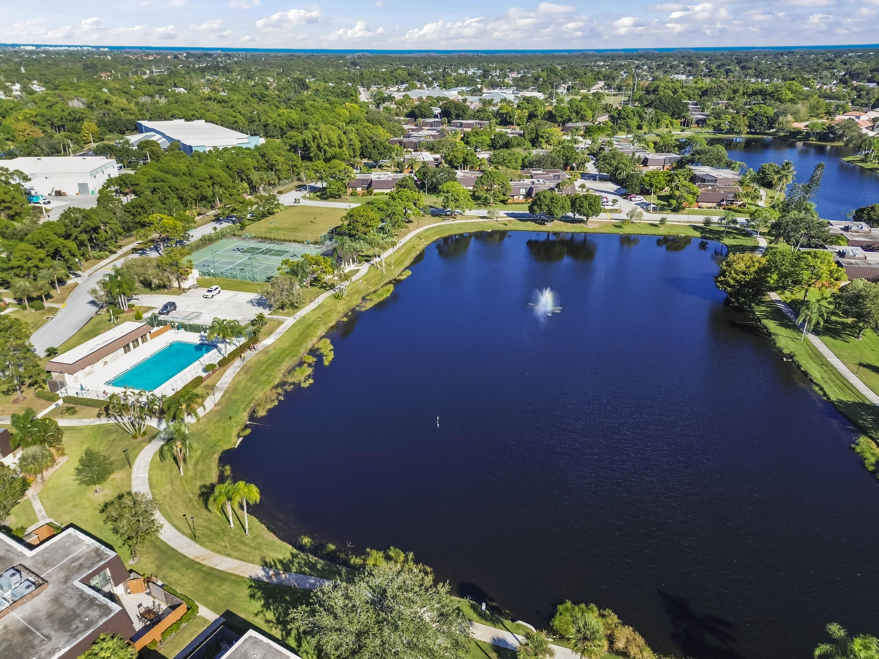 5708 Southeast Windsong Lane Stuart, FL 34997 - Photo 32 of 41 a view of a lake with outdoor space