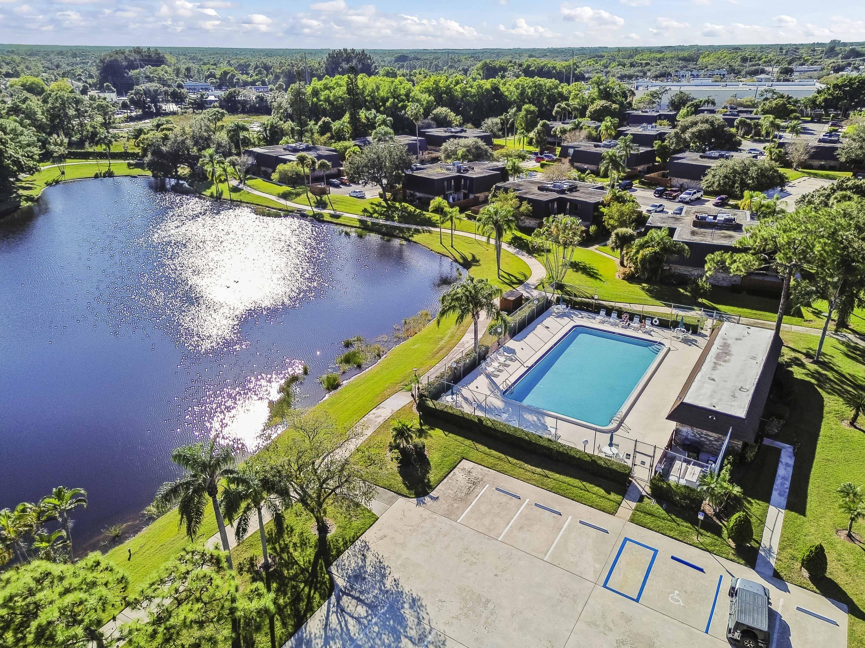 5708 Southeast Windsong Lane Stuart, FL 34997 - Photo 36 of 41 an aerial view of a house with a swimming pool yard and outdoor seating