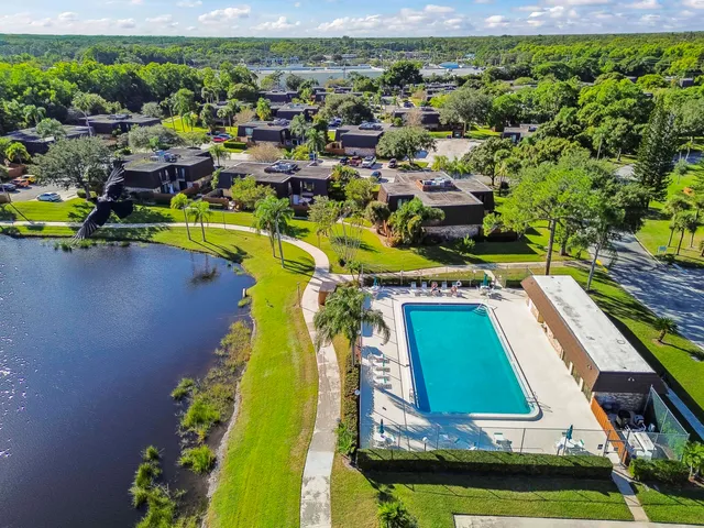 a view of a swimming pool with outdoor seating and yard