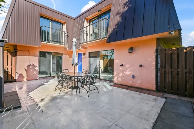 a view of a building with sitting area