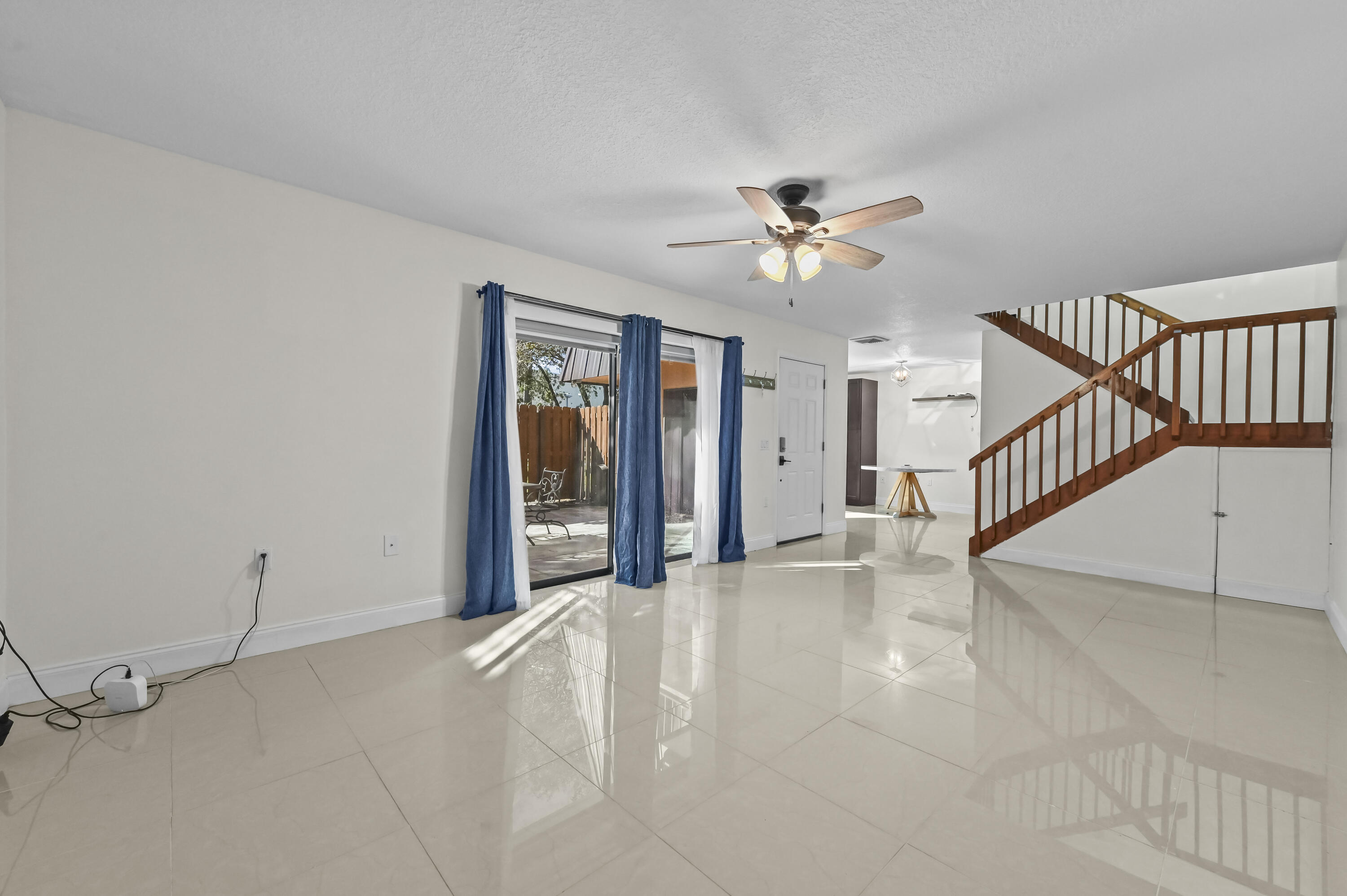 5708 Southeast Windsong Lane Stuart, FL 34997 - Photo 10 of 41 a view of an empty room with a window