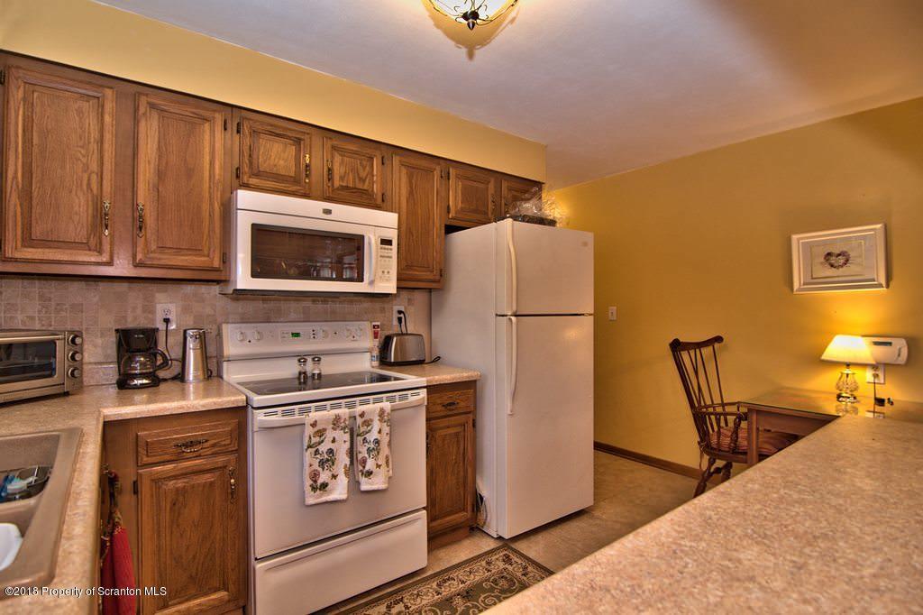 453 Randolph Road Great Bend, PA 18821 - Photo 23 of 43 a kitchen with stainless steel appliances granite countertop a refrigerator stove top oven a sink and dishwasher