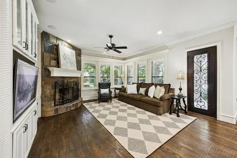 a living room with furniture fireplace and flat screen tv